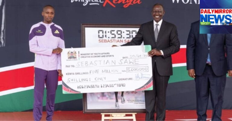 President William Ruto(right) pictured holding a Ksh5million cheque with world record holder Sabastian Sawe in State House, during Sawe's welcome home ceremony on April 30.